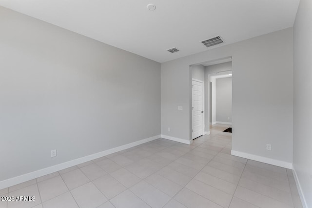 1301 W Via De Olivos, Queen Creek, AZ 85140 - spare room with baseboards and light tile patterned floors