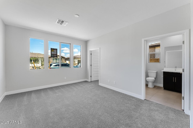 1301 W Via De Olivos, Queen Creek, AZ 85140 - unfurnished bedroom with carpet, a sink, baseboards, and ensuite bathroom