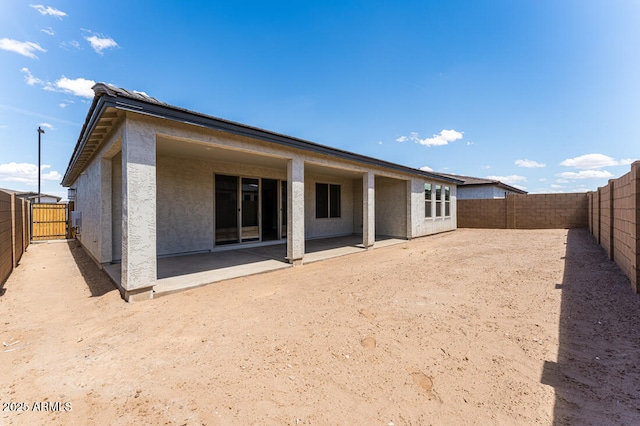 1301 W Via De Olivos, Queen Creek, AZ 85140 - back of house with stucco siding, a fenced backyard, and a patio area