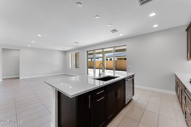 1301 W Via De Olivos, Queen Creek, AZ 85140 - kitchen featuring a sink, dishwasher, light countertops, a kitchen island with sink, and recessed lighting