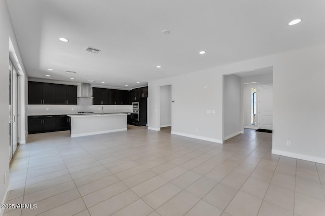 1301 W Via De Olivos, Queen Creek, AZ 85140 - unfurnished living room featuring recessed lighting, light tile patterned floors, baseboards, and a sink