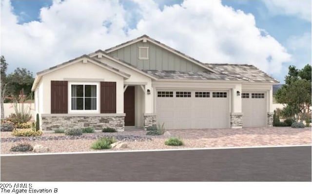 craftsman-style home featuring board and batten siding, stone siding, driveway, and a garage