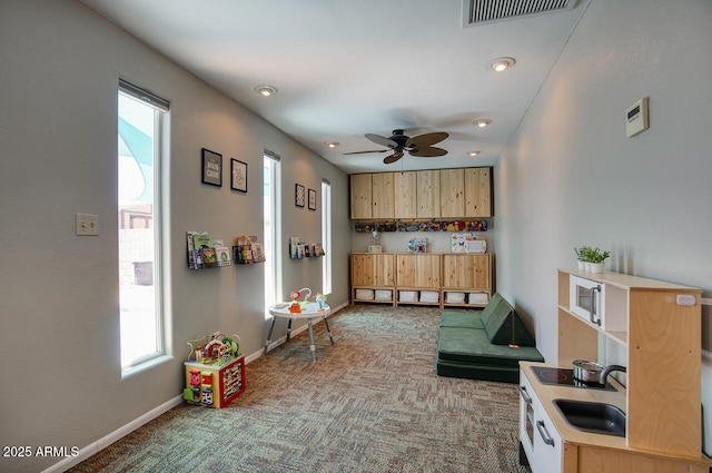 3203 W Libby St, Phoenix, AZ 85053 - kitchen featuring carpet, healthy amount of natural light, light brown cabinetry, ceiling fan, and recessed lighting