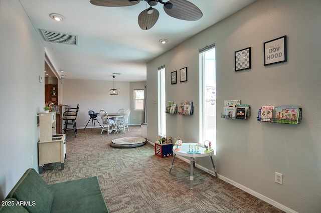 3203 W Libby St, Phoenix, AZ 85053 - living room featuring carpet floors and ceiling fan