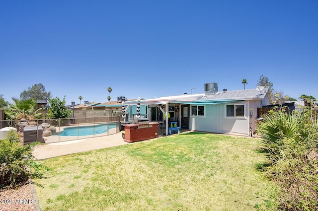 3203 W Libby St, Phoenix, AZ 85053 - rear view of house with a fenced backyard, a hot tub, and a patio area