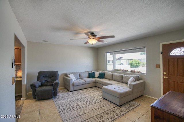 3203 W Libby St, Phoenix, AZ 85053 - living area with light tile patterned flooring, ceiling fan, and a textured ceiling