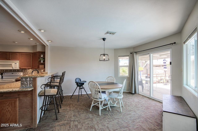 3203 W Libby St, Phoenix, AZ 85053 - dining room with light colored carpet and recessed lighting