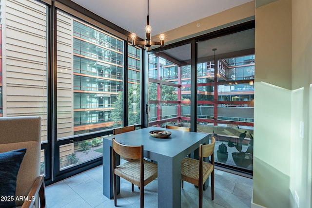 dining room featuring tile patterned flooring, floor to ceiling windows, and an inviting chandelier