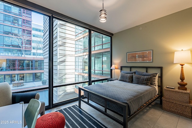 bedroom with light tile patterned flooring and floor to ceiling windows