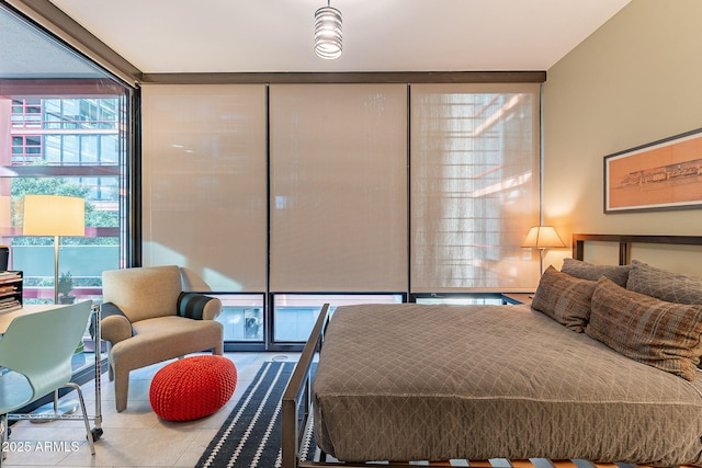 tiled bedroom with floor to ceiling windows