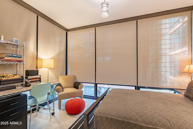 tiled bedroom featuring a wall of windows