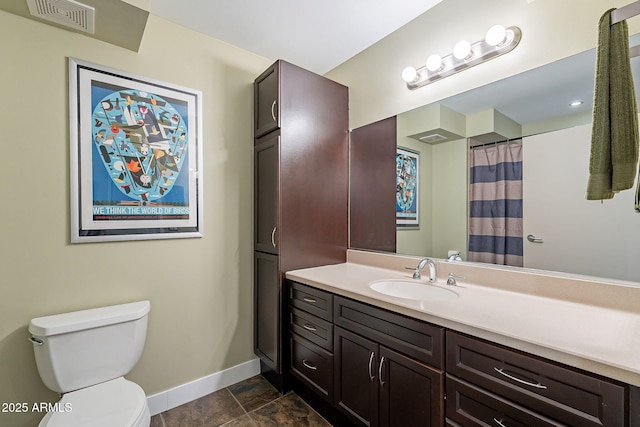 bathroom with a shower with curtain, vanity, and toilet