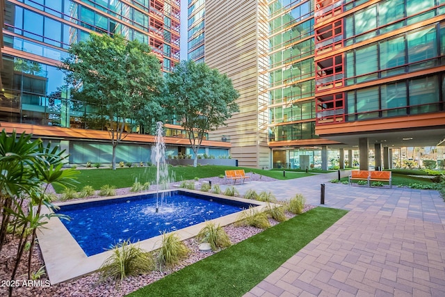 view of pool with pool water feature