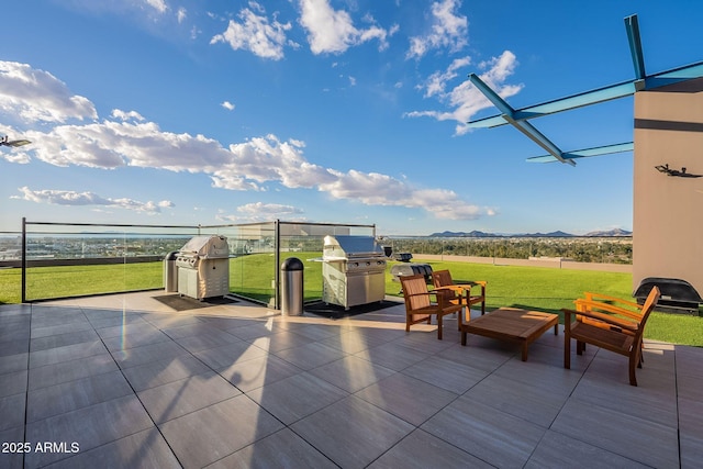 view of patio / terrace featuring area for grilling and a mountain view