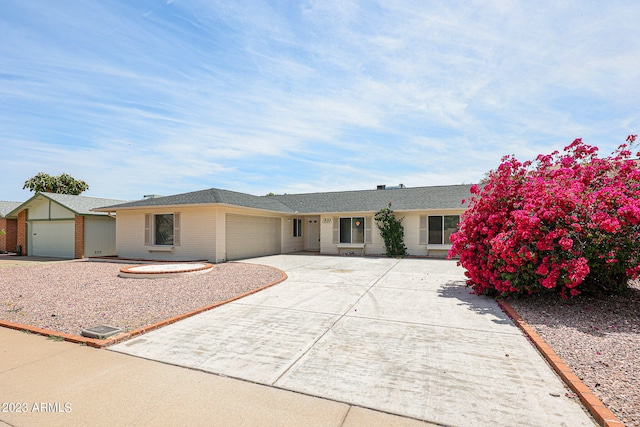 ranch-style home featuring a garage