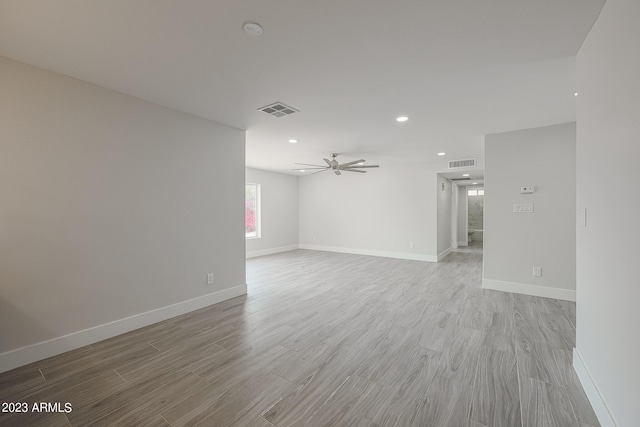 unfurnished room featuring ceiling fan and light hardwood / wood-style flooring