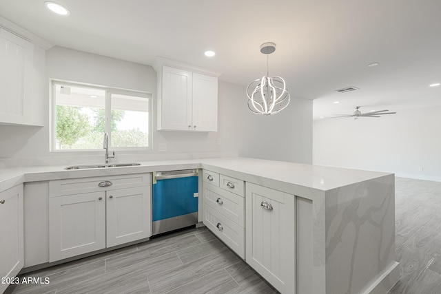 kitchen with sink, dishwasher, and kitchen peninsula