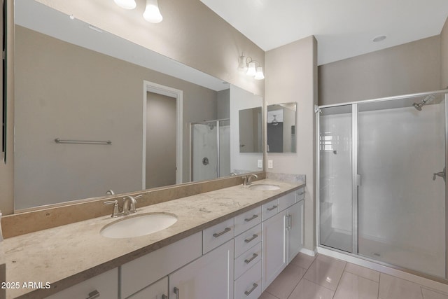 bathroom featuring vanity, tile patterned floors, and a shower with shower door