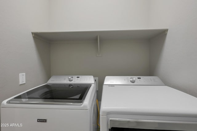 washroom featuring washer and dryer