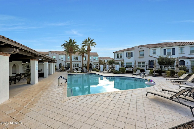 view of swimming pool with a patio