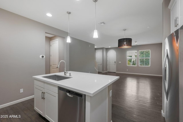 kitchen featuring white cabinetry, sink, an island with sink, and appliances with stainless steel finishes