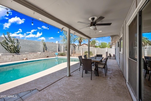 4136 W Hearn Rd, Phoenix, AZ 85053 - fenced backyard with a patio area, a ceiling fan, and outdoor dining space