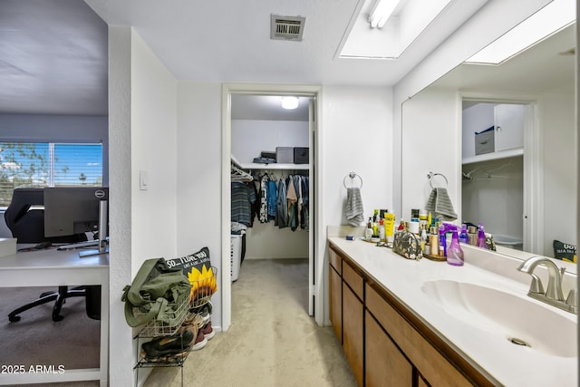 4136 W Hearn Rd, Phoenix, AZ 85053 - bathroom featuring vanity and a spacious closet