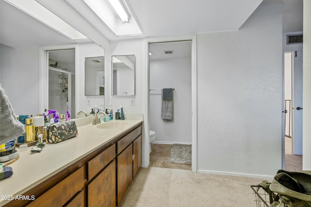 4136 W Hearn Rd, Phoenix, AZ 85053 - full bath featuring toilet, vanity, a shower stall, and baseboards