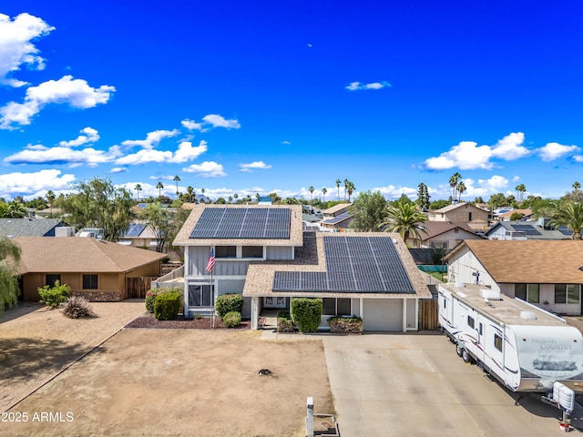 4136 W Hearn Rd, Phoenix, AZ 85053 - view of front of house with solar panels, a residential view, driveway, and a tile roof