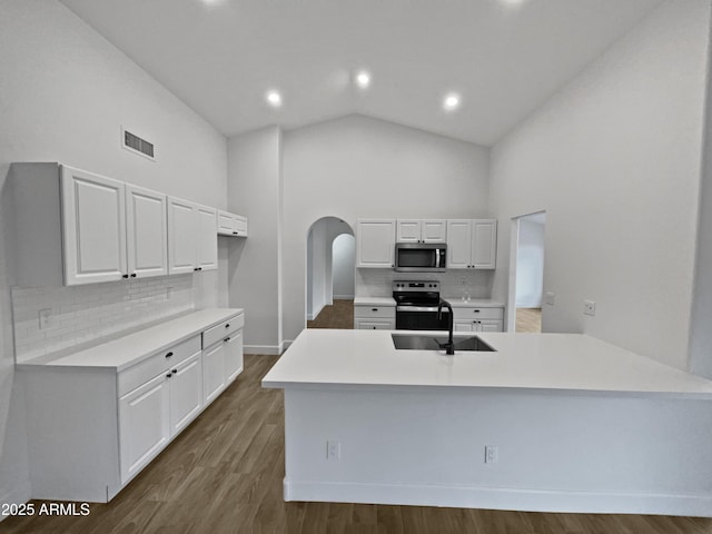 kitchen featuring a sink, stainless steel appliances, light countertops, and white cabinetry