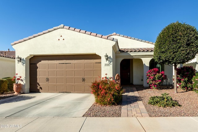 mediterranean / spanish-style home featuring a garage