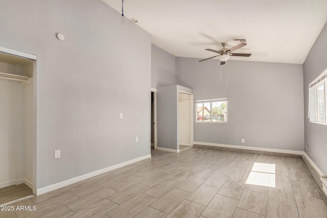 7506 W Sells Dr, Phoenix, AZ 85033 - unfurnished bedroom with multiple windows, wood finish floors, high vaulted ceiling, and baseboards