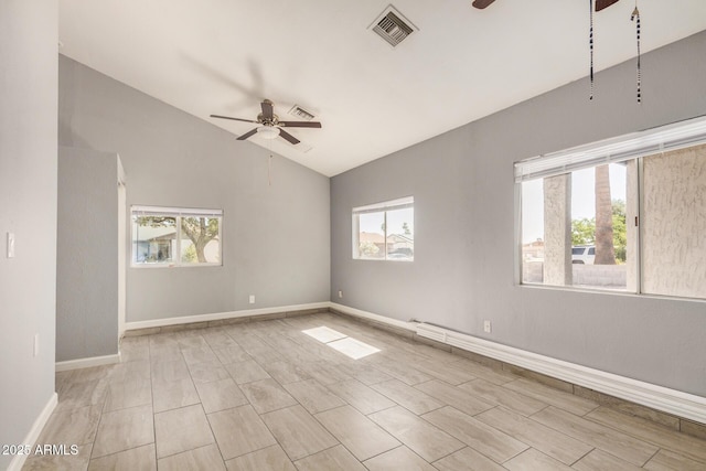 7506 W Sells Dr, Phoenix, AZ 85033 - spare room with ceiling fan, lofted ceiling, and baseboards