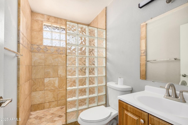 7506 W Sells Dr, Phoenix, AZ 85033 - bathroom featuring a walk in shower, toilet, and vanity