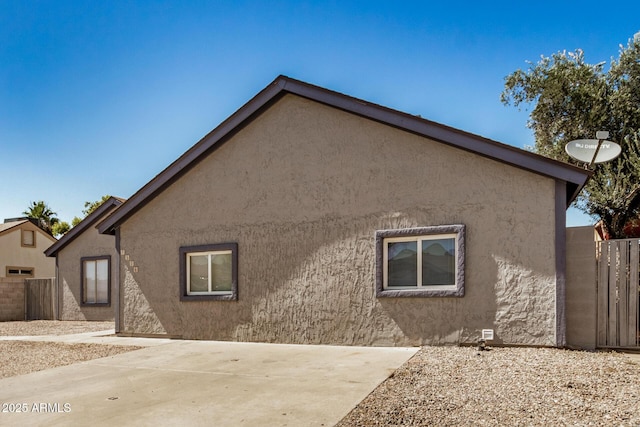7506 W Sells Dr, Phoenix, AZ 85033 - view of property exterior with a patio and stucco siding