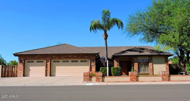 6372 W Redfield Rd, Glendale, AZ 85306 - single story home with a garage, concrete driveway, and brick siding
