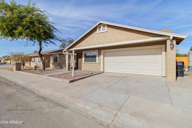 single story home featuring a garage