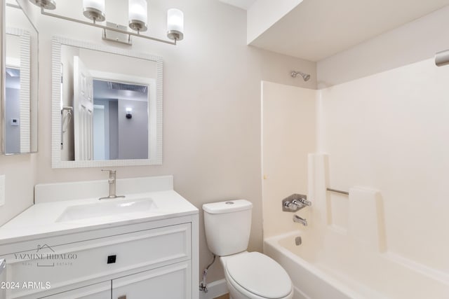 full bathroom featuring vanity,  shower combination, and toilet