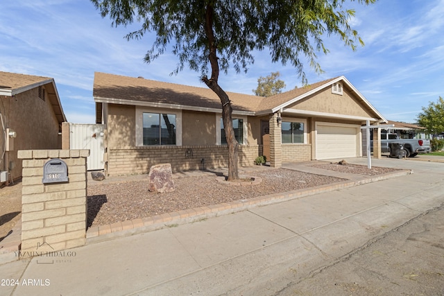 single story home featuring a garage