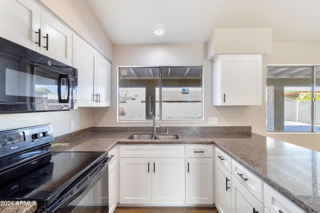 kitchen with black appliances, white cabinets, sink, and dark stone counters