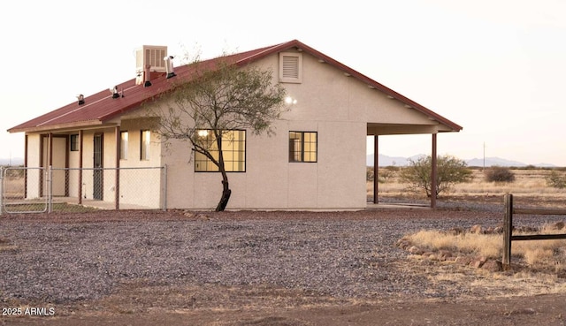 view of side of home with a mountain view