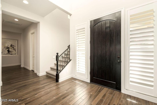 foyer entrance with dark wood-type flooring