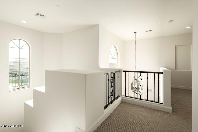 hallway featuring carpet flooring