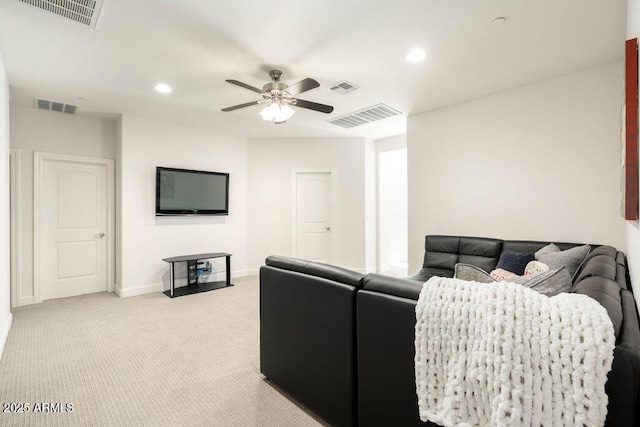 living room featuring light colored carpet and ceiling fan