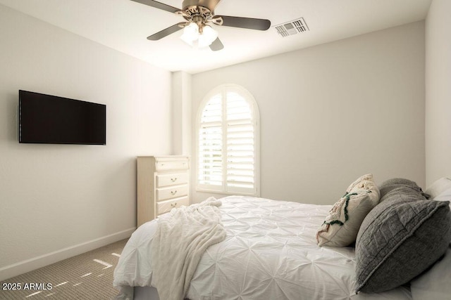 bedroom with ceiling fan and carpet