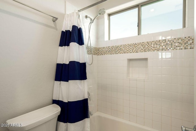 bathroom featuring toilet and shower / bath combo with shower curtain