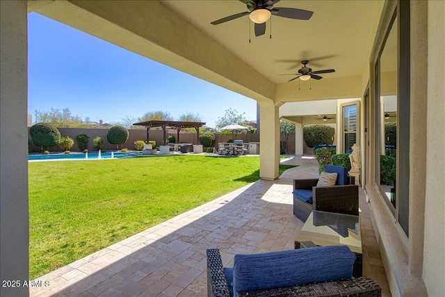 view of patio featuring a fenced in pool, an outdoor living space, and ceiling fan