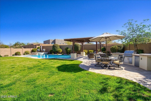 view of yard with a fenced in pool, a pergola, a patio area, and exterior kitchen