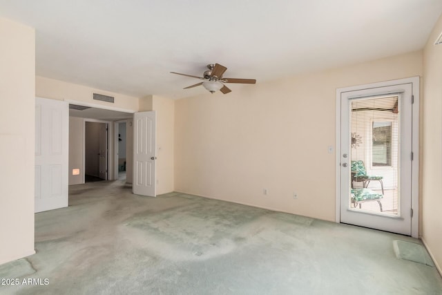 carpeted empty room with ceiling fan