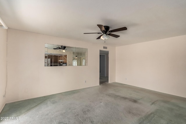 unfurnished living room with carpet and ceiling fan